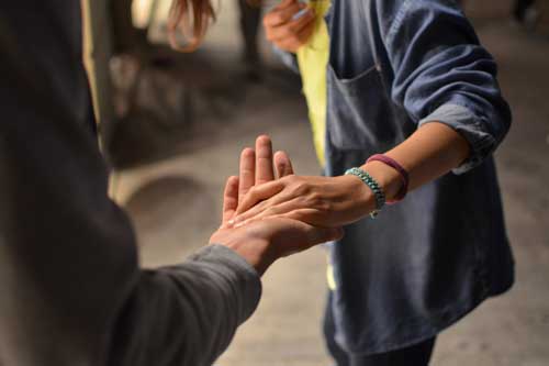 woman offering a helping hand.