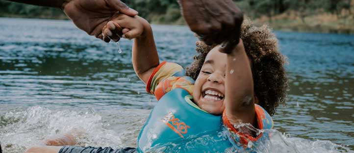 child playing in water.