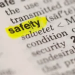 Closeup of the word "safety" in the dictionary, highlighted in yellow