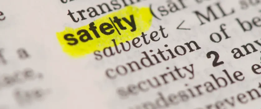 Closeup of the word "safety" in the dictionary, highlighted in yellow