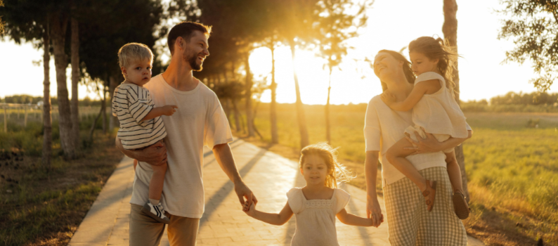 A family walking together at sunset