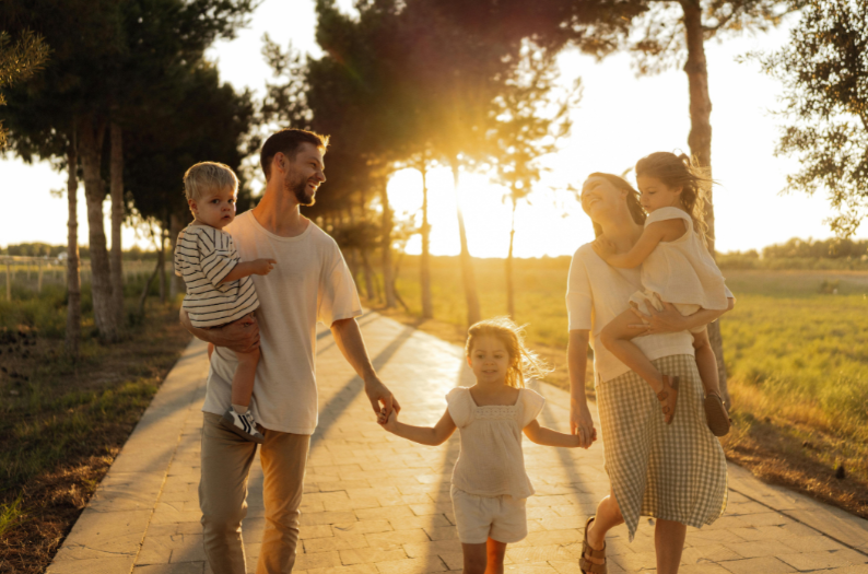 A family walking together at sunset