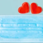 Medical mask with two hearts above it