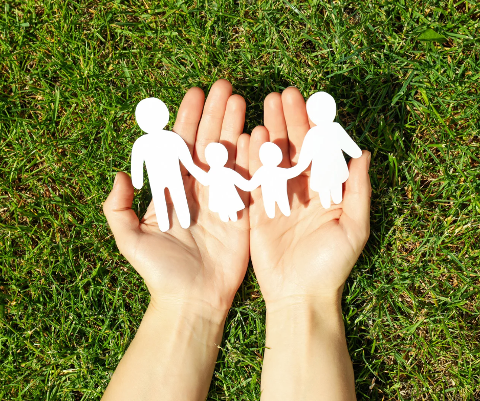 Hands holding a paper family chain