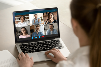 Woman attending a virtual meeting on a laptop